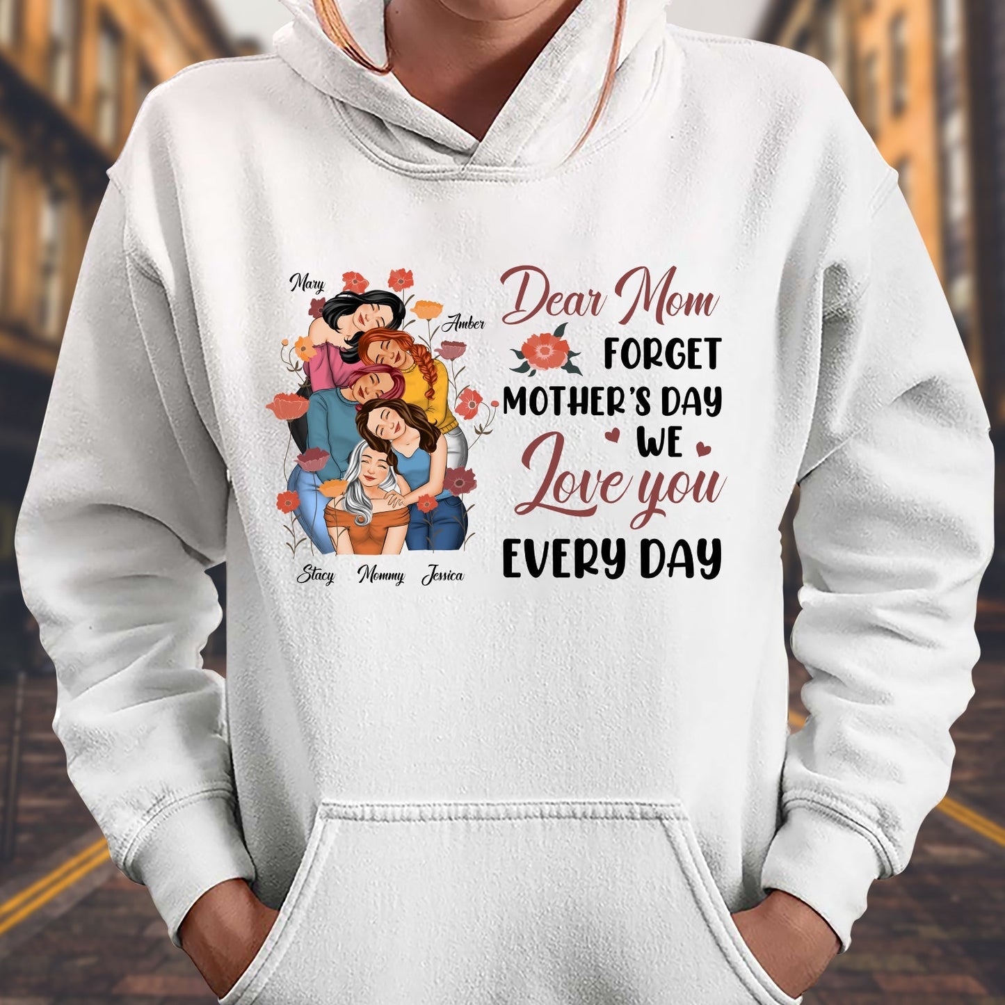 White hoodie featuring we love you every day mom tee design with colorful family illustration and loving message