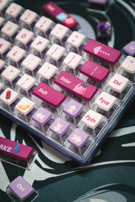 A close up of a pink and purple keyboard