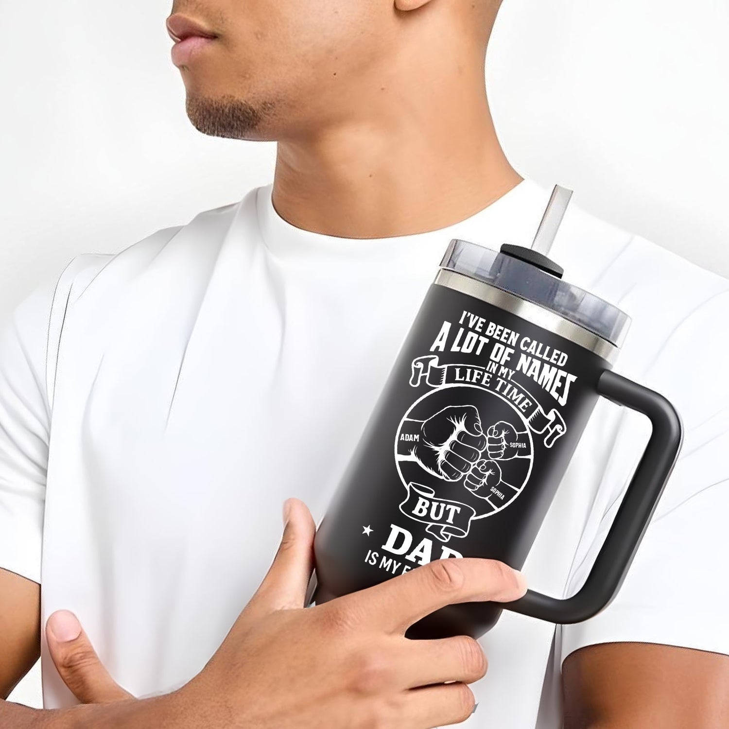Man holding black insulated tumbler with custom dad design for personalized best seller gifts collection