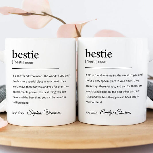 Pair of personalized white bestie definition mugs with names printed custom friendship gift for office
