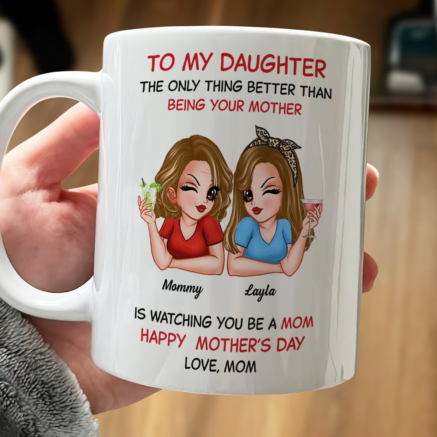 White ceramic mug with cartoon mom and daughter holding drinks and text for a custom mom to daughter gift