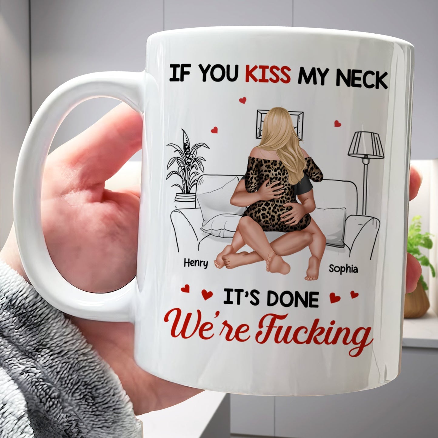 White custom romantic coffee mug with couple on couch labeled Henry and Sophia and text If you kiss my neck its done Were Fucking