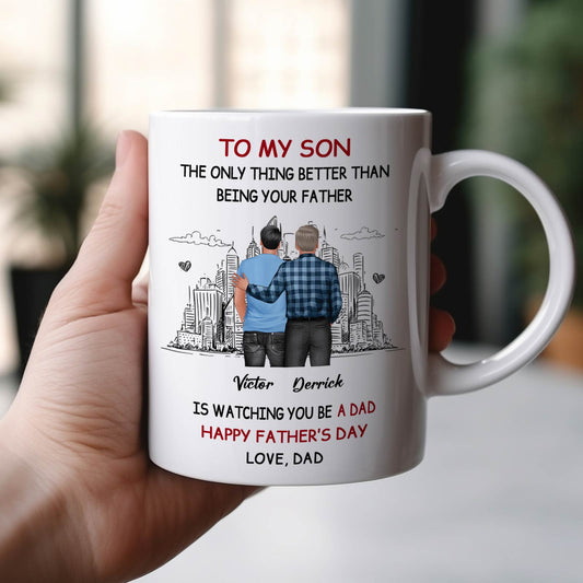 White ceramic happy Father's Day personalized mug showing father and son illustration with skyline and heartfelt message