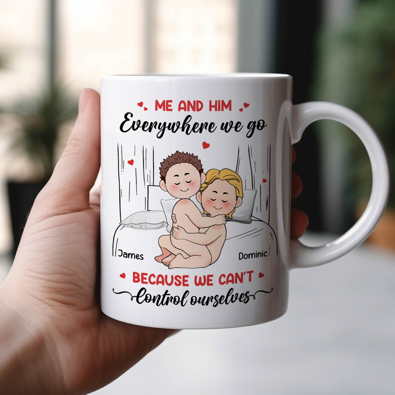 White ceramic me and him everywhere we go mug showing cartoon couple cuddling in bed with names James and Dominic