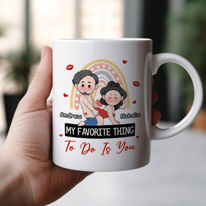 Hand holding 365Gifty white ceramic my favorite thing to do is you mug featuring cartoon couple Andrew Natalie and hearts