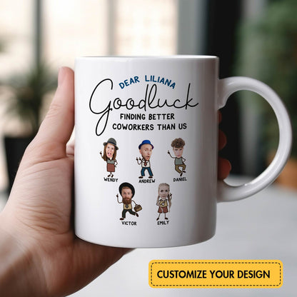 White ceramic personalized coworker mug held in hand with custom caricature faces and names and Goodluck message to Liliana