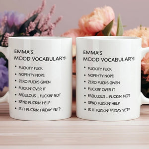 Two white personalized funny office mugs with Emmas mood vocabulary listing humorous swear phrases