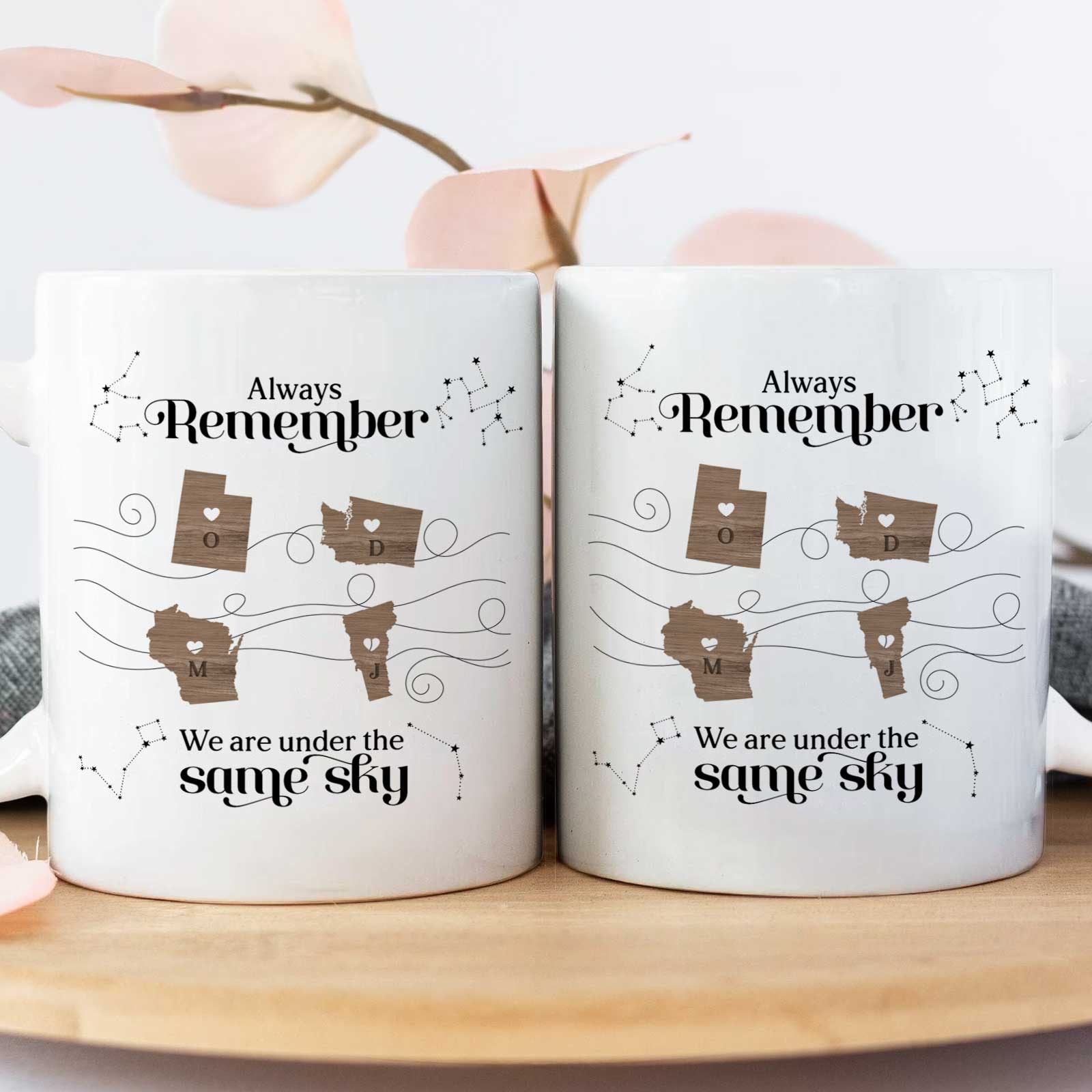 Pair of matching ceramic mugs with map hearts and constellations Always Remember design unique gift for long distance friends