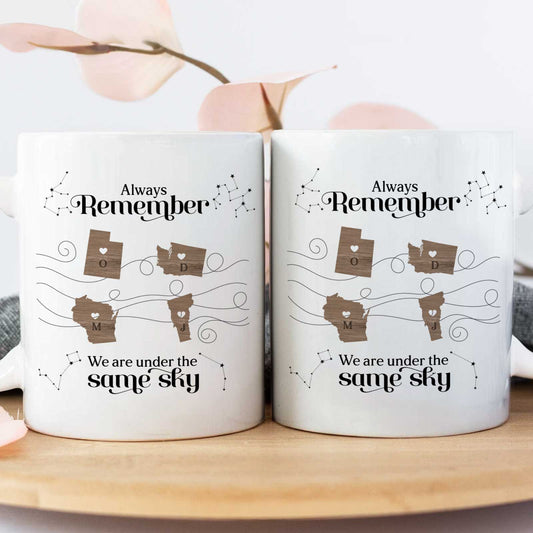 Pair of matching ceramic mugs with map hearts and constellations Always Remember design unique gift for long distance friends