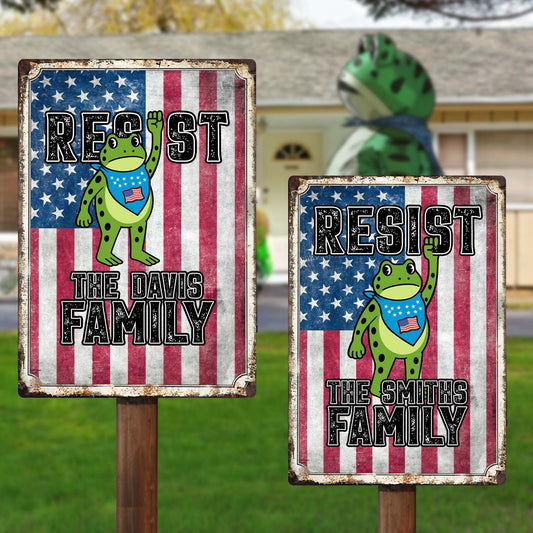 Personalized patriotic metal sign featuring cartoon frog design with custom family names and American flag backdrop