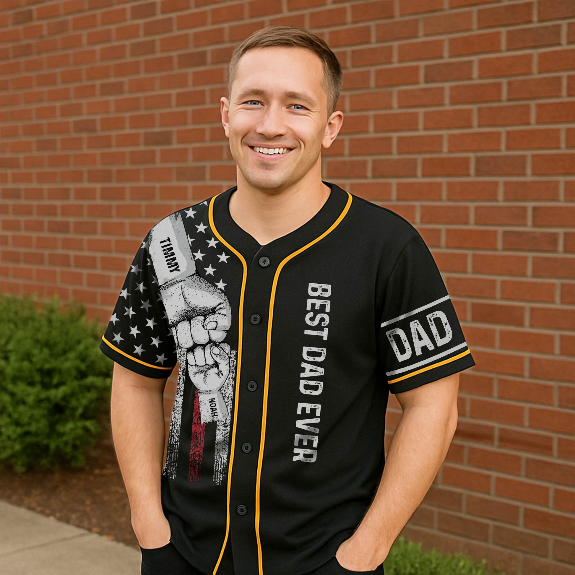 Black best dad ever Hawaiian shirt with fist bump design and yellow trim worn by smiling man