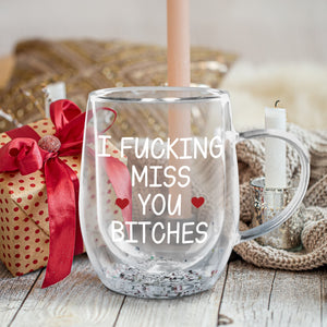Funny clear glass mug with I F*CKING MISS YOU BITCHES print, perfect for best friend birthday gift ideas