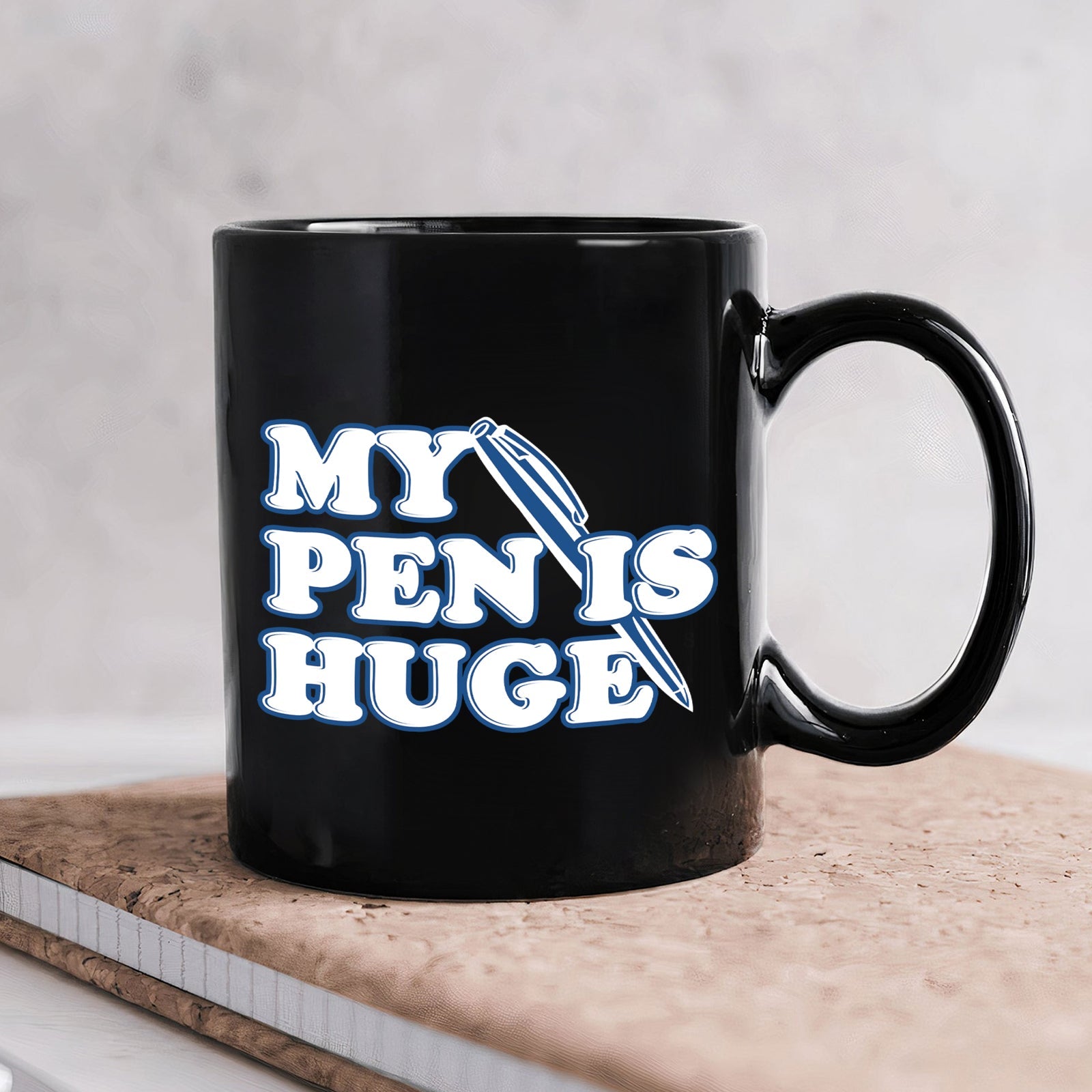 Black ceramic 11oz my pen is huge coffee mug with bold white and blue typography and pen graphic