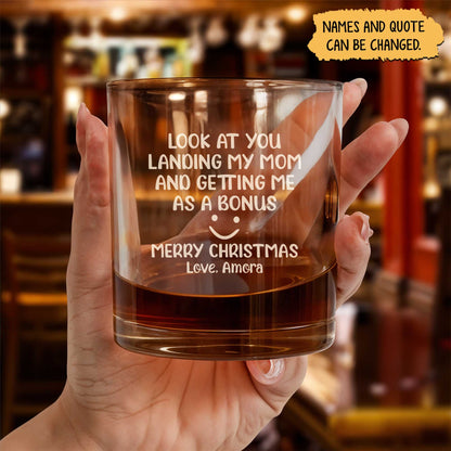 Personalized Whiskey Glass held in hand with engraved funny Christmas message and custom name gift