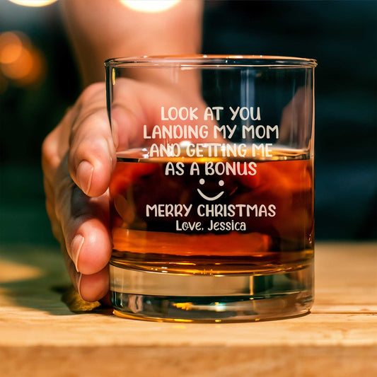 Personalized Whiskey Glass with funny Christmas message held in hand showing name Jessica and amber whiskey