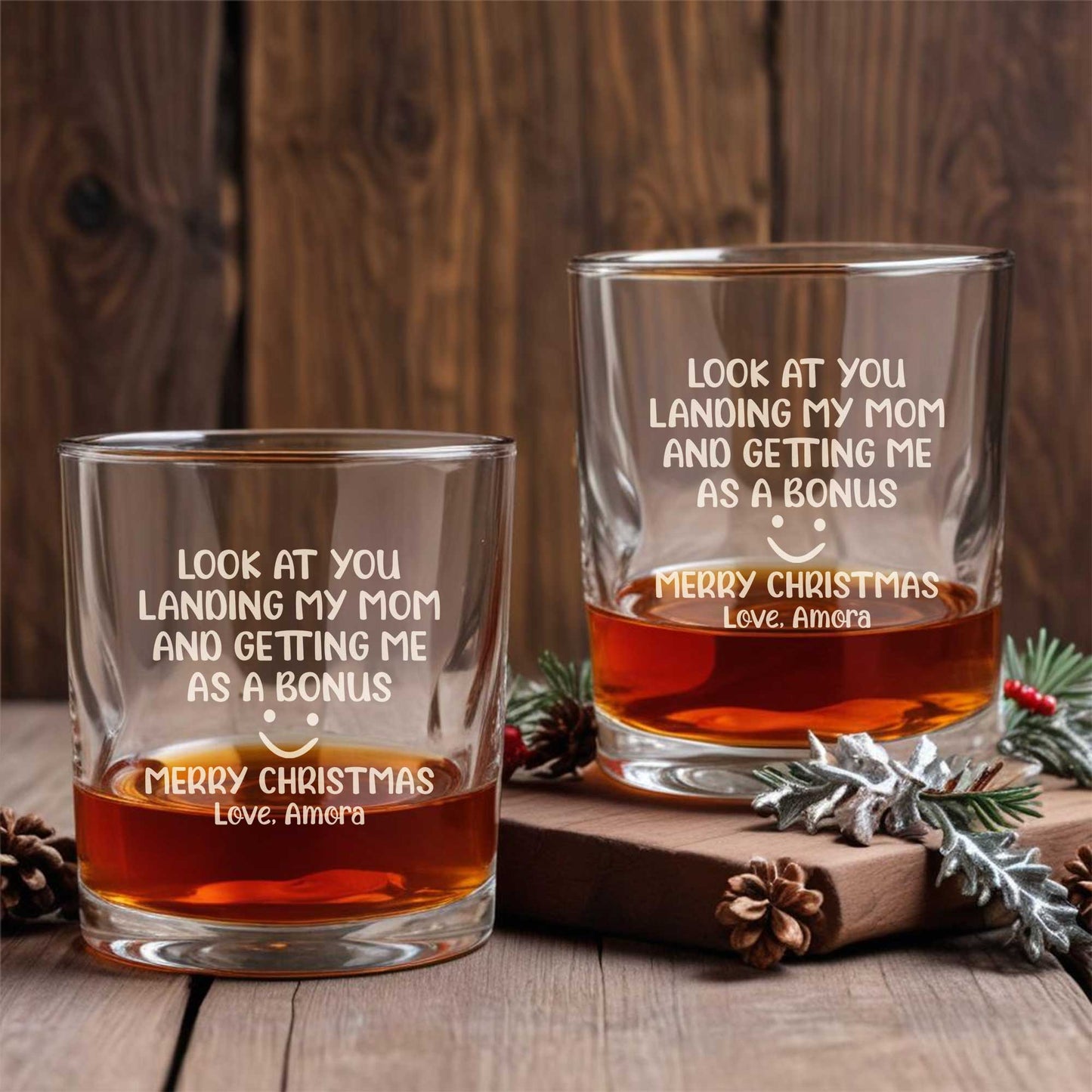 Personalized Whiskey Glass set with funny holiday message on two rocks glasses filled with whiskey