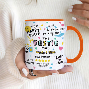 Colorful ceramic personalized best friend mug with orange handle and rim, playful doodle design and custom names Wendy and Diana