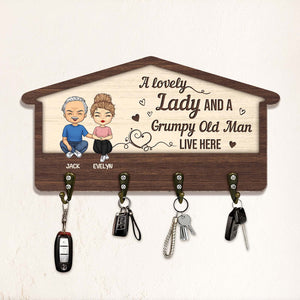 Custom couple key holder featuring cartoon characters and hooks for keys and accessories