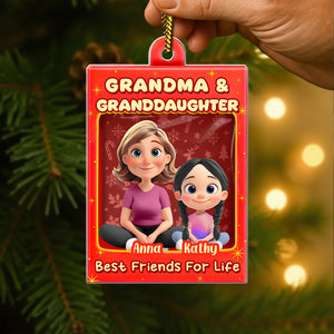 Custom family Christmas acrylic ornament featuring a grandmother and granddaughter design with names and a festive background