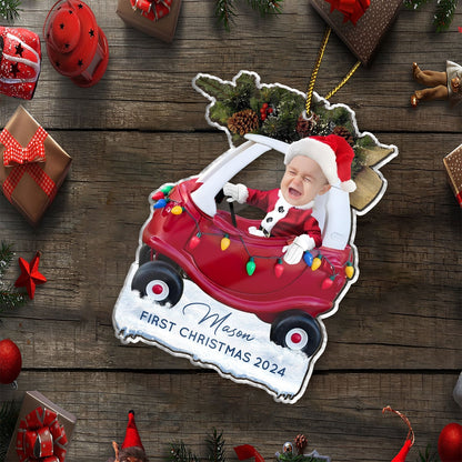 Custom first Christmas acrylic ornament featuring a baby in a red car with holiday lights and Santa hat