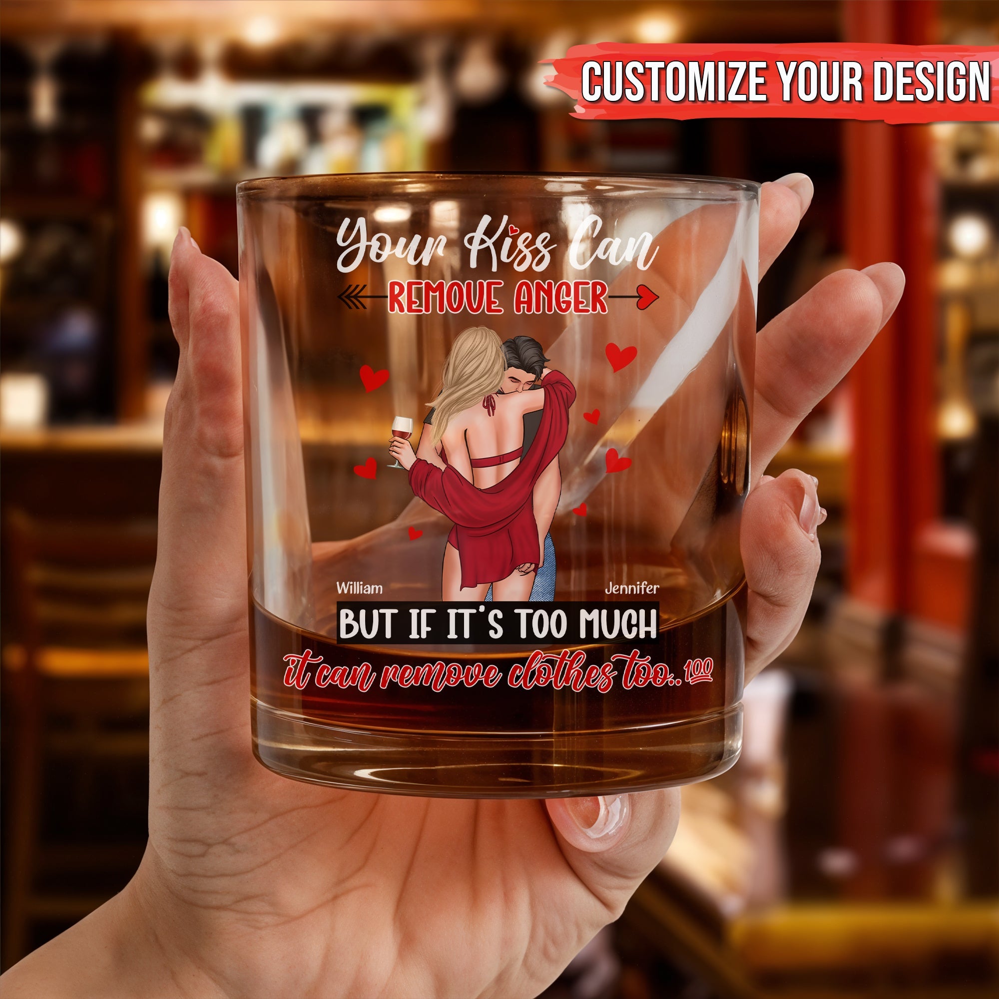 Personalized Whiskey Glass with romantic couple design and custom names held in hand over bar background