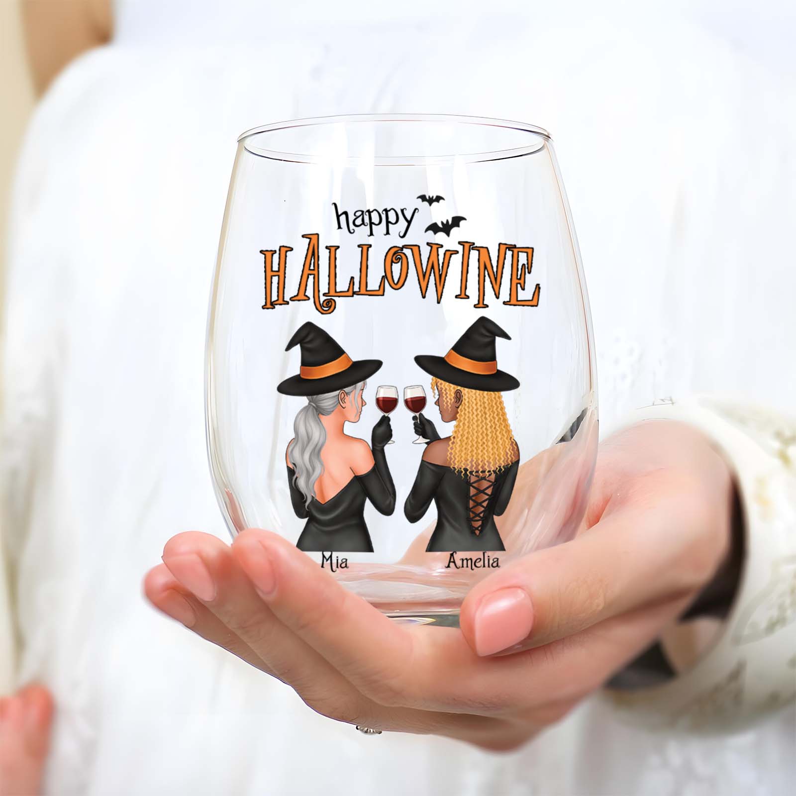 Custom Halloween wine glass featuring two witches celebrating with wine and the text 'Happy Hallowine'