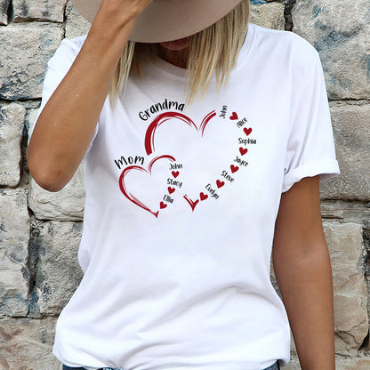 Woman wearing a white custom light of my life shirt with red heart designs and personalized family names