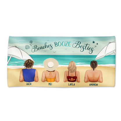Personalized Beach Towel Beaches BOOZE Besties showing four friends on sand facing ocean under umbrellas with names