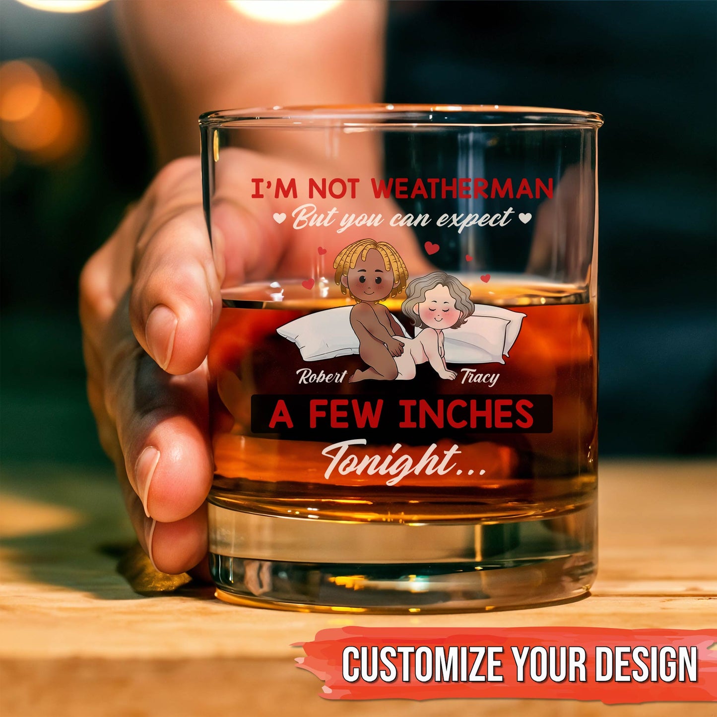 Personalized Whiskey Glass with humorous romantic design showing custom names held in hand over whiskey