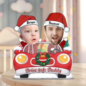Custom photo shaking head standee featuring two characters in Christmas hats in a festive car