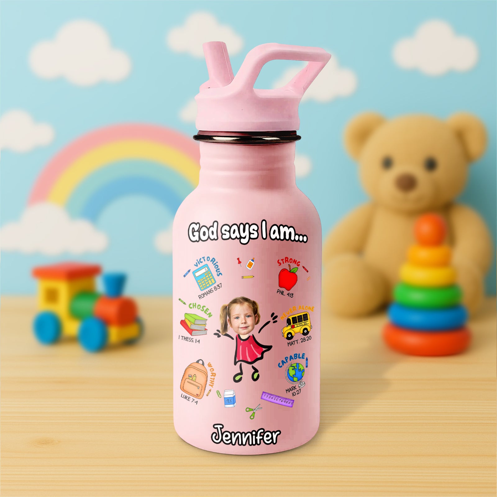 Pink Water Bottle For Kids with inspirational design and personalized name on a wooden table