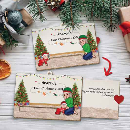 Custom wooden Christmas slider card with festive trees and child illustrations for First Christmas 2024