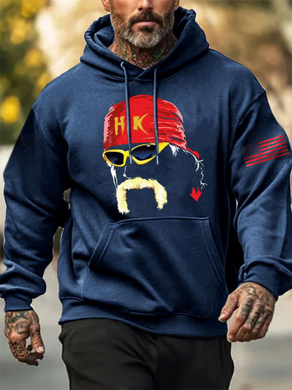 Man wearing navy blue hoodie with custom wrestling fan apparel graphic featuring red bandana and yellow sunglasses