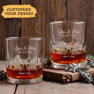 personalized couple whiskey glass set showing two glasses with illustrated couple in chairs holding hands and custom names