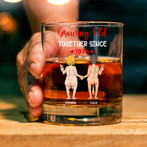Personalized Whiskey Glass featuring cartoon couple holding hands from behind with Growing Old Together Since 1976 text and names