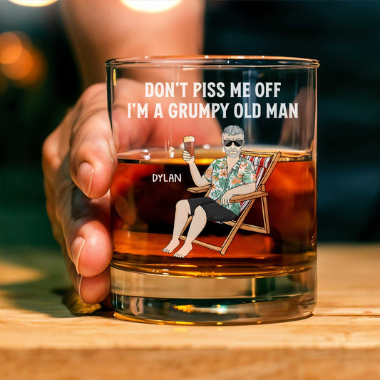Personalized Whiskey Glass showing grumpy old man illustration with text Dont Piss Me Off and name Dylan