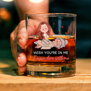 Personalized Whiskey Glass with amber whiskey held in hand featuring playful cartoon of two women and printed caption