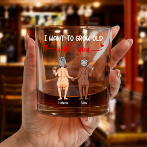 Personalized Whiskey Glass showing hand holding glass with elderly nude couple illustration holding hands and names Helena Silas