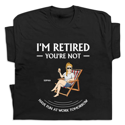 Black personalized retirement t-shirt with a woman relaxing in a chair and text saying I’m retired you’re not