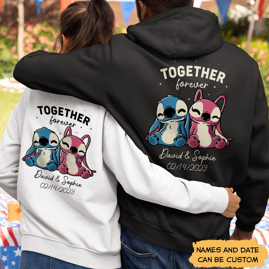 Couple wearing customized romantic hoodie for couples with cute cartoon characters and personalized names and date
