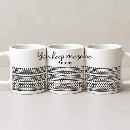 Three white ceramic personalized 'You Keep Me Sane' mug set with black geometric pattern and name Antony