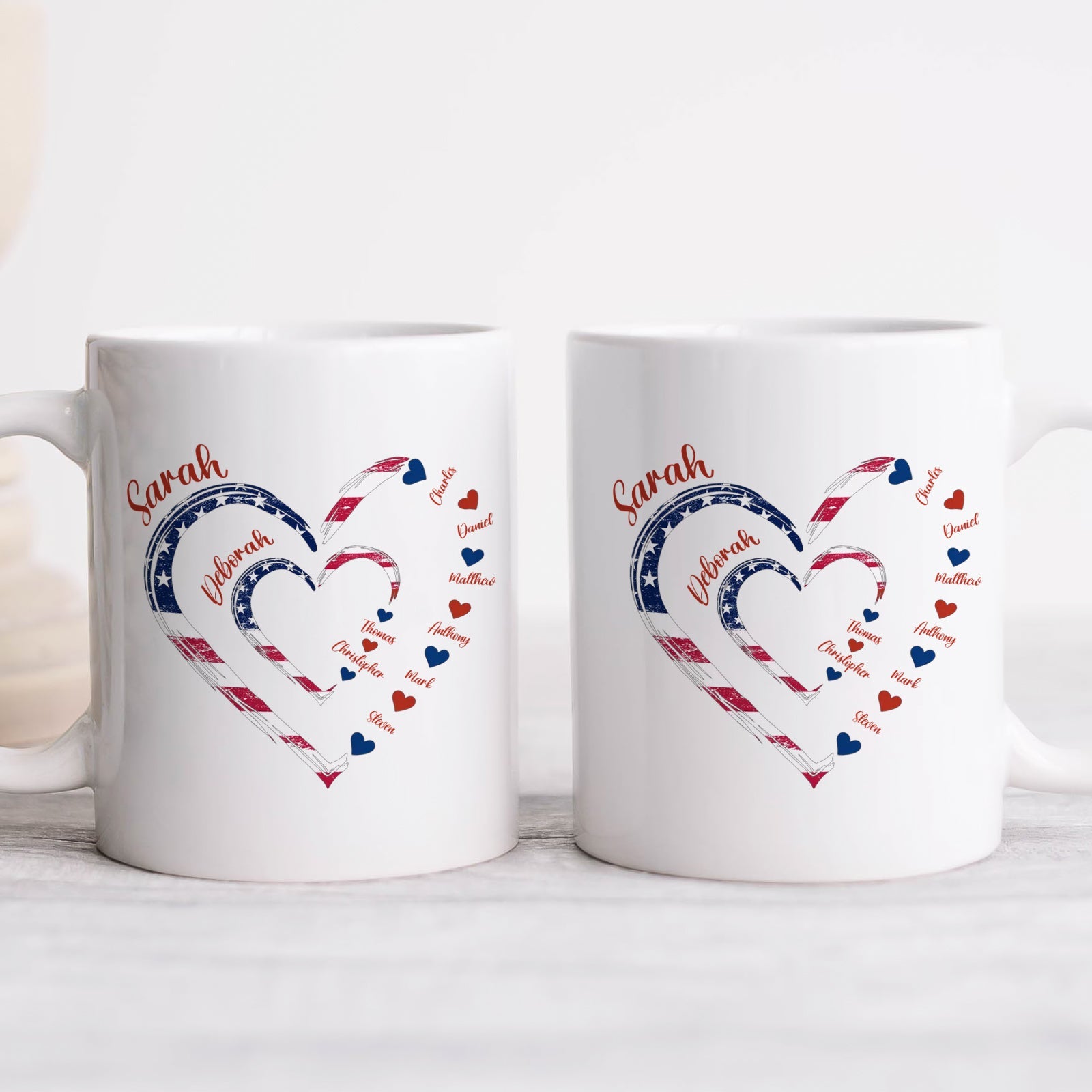Two personalized white mugs with American flag heart design and name Sarah custom first mom now grandma gift