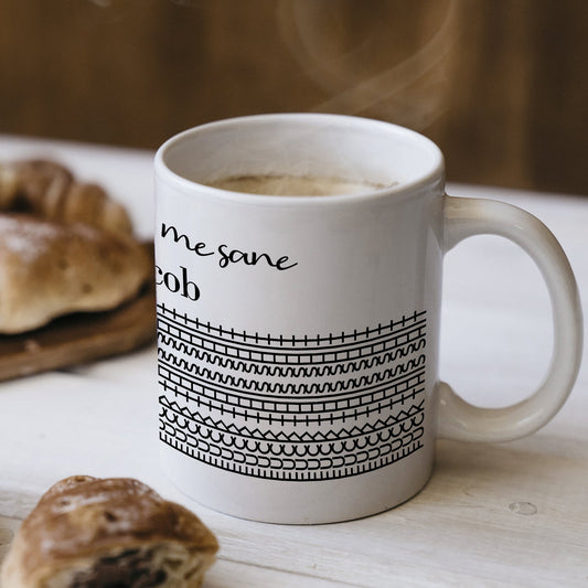 personalized 'You Keep Me Sane' mug white ceramic with black geometric stripes filled with coffee beside pastries