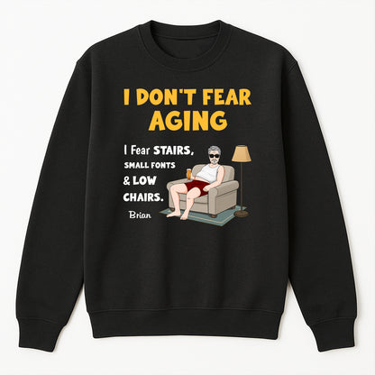 Black sweatshirt personalized retirement shirt with humorous I Dont Fear Aging design and seated man illustration