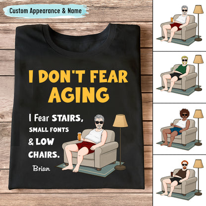 Black personalized retirement shirt with humorous I DONT FEAR AGING design showing man in chair and custom name