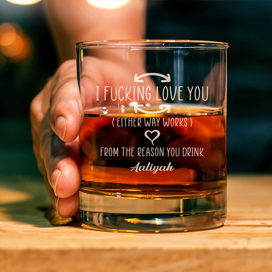 Personalized Whiskey Glass from 365Gifty held by hand with engraved romantic message and amber whiskey