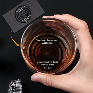 Hand holding Personalized Whiskey Glass with spiral bottom engraving reading explicit sexual message and name Love John