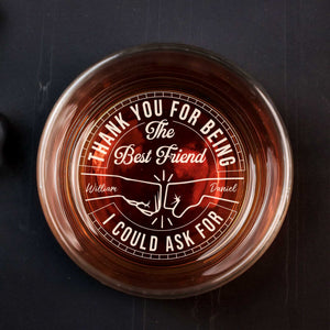 Personalized Whiskey Glass top view with engraved thank you best friend message names William and Daniel over amber whiskey