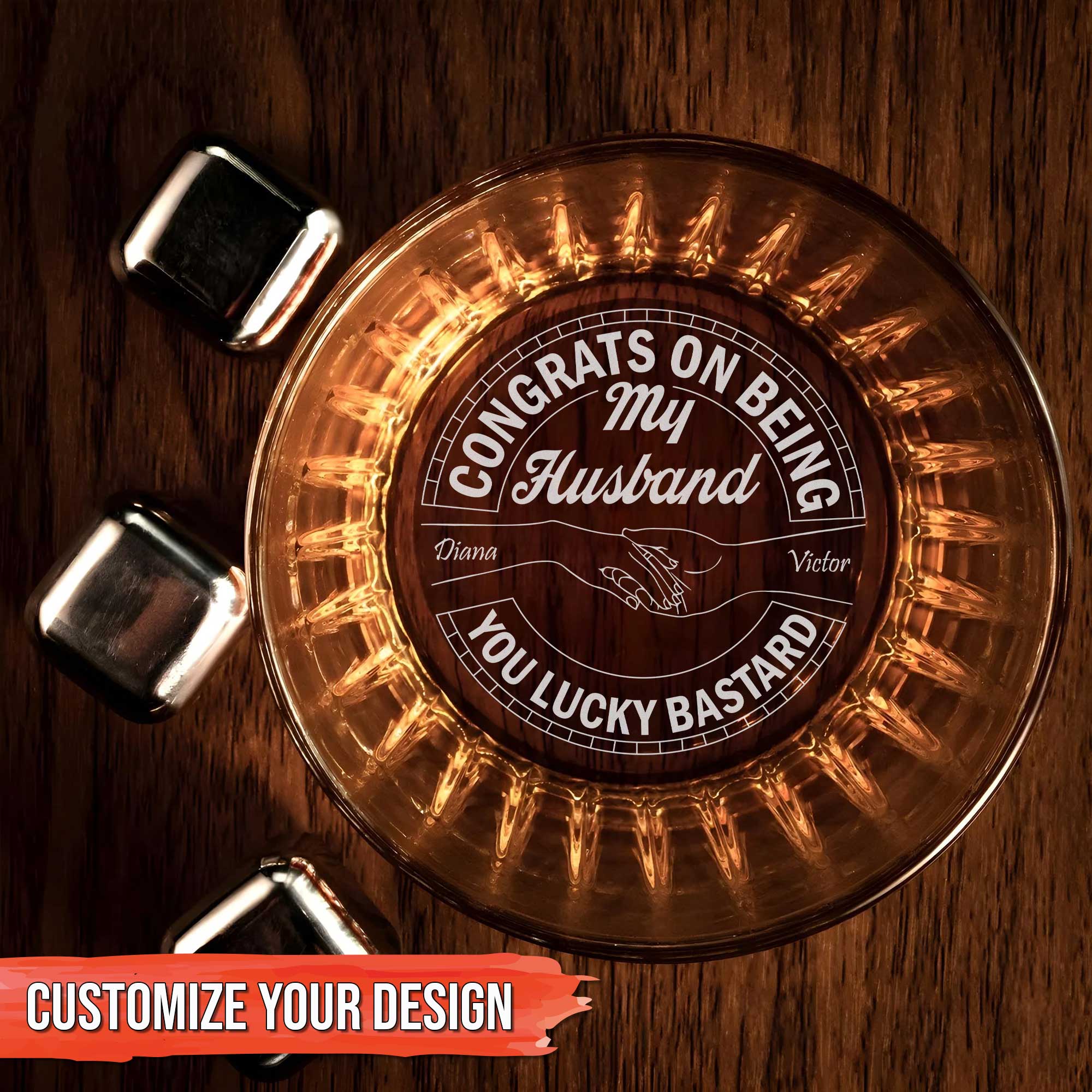 Personalized Whiskey Glass engraved with Congrats on Being My Husband message and names with whiskey stones on wooden table
