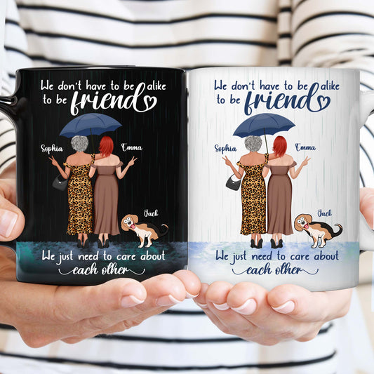 we just need to care about each other mug design on two mugs showing two friends under umbrella with dog names Sophia Emma Jack